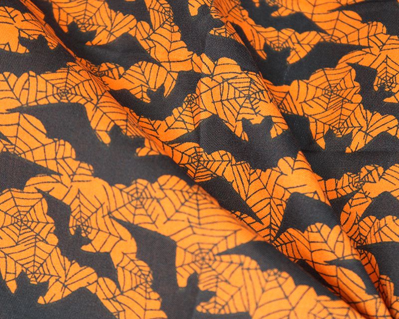 80% Cotton, 20% poly halloween bats on orange.