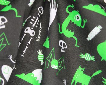 80% Cotton, 20% poly ghosts and ghouls on black.