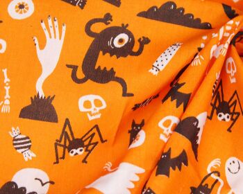 80% Cotton, 20% poly ghosts and ghouls on orange.
