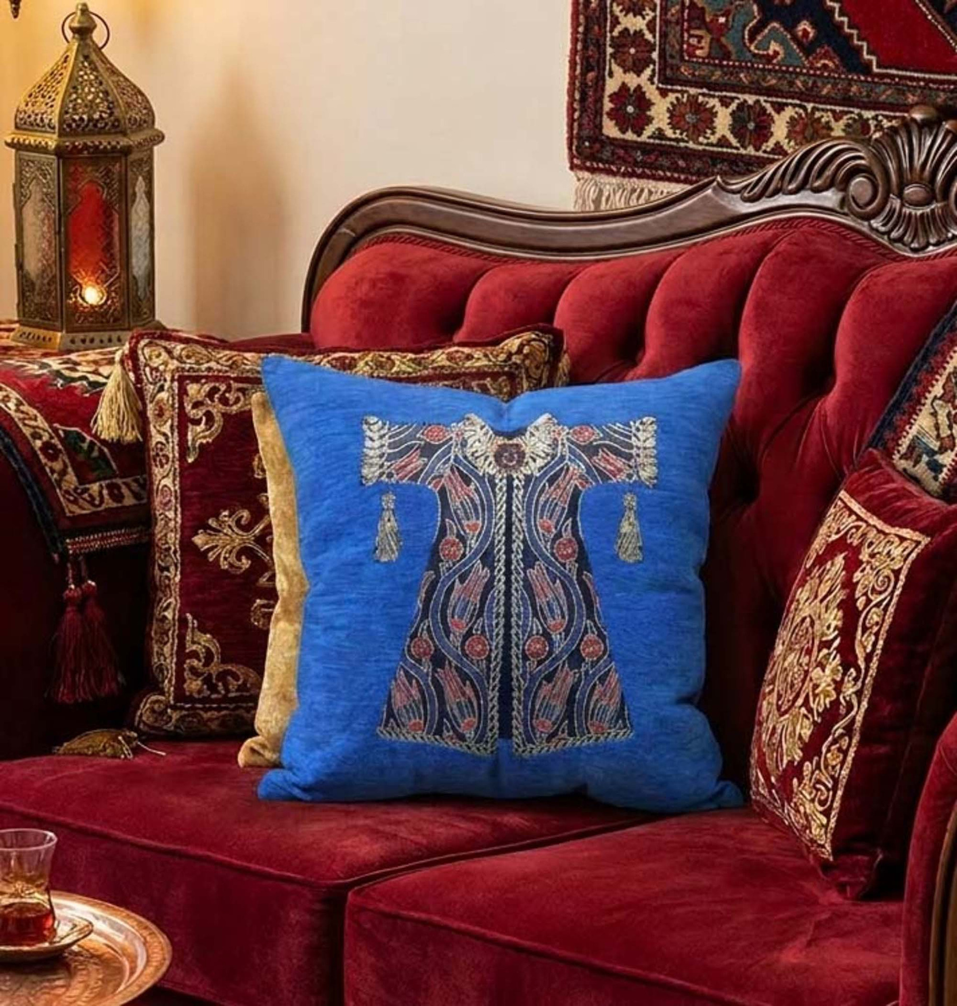 Royal blue chenille cushion with a Turkish kaftan motif
