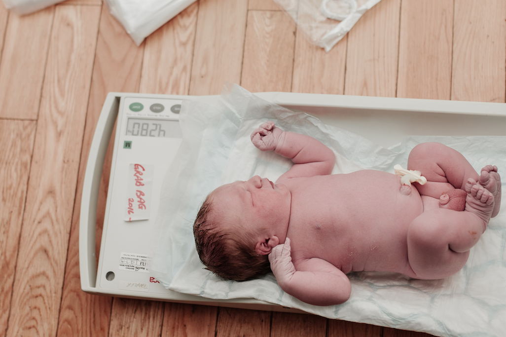 Newborn Baby being weighed