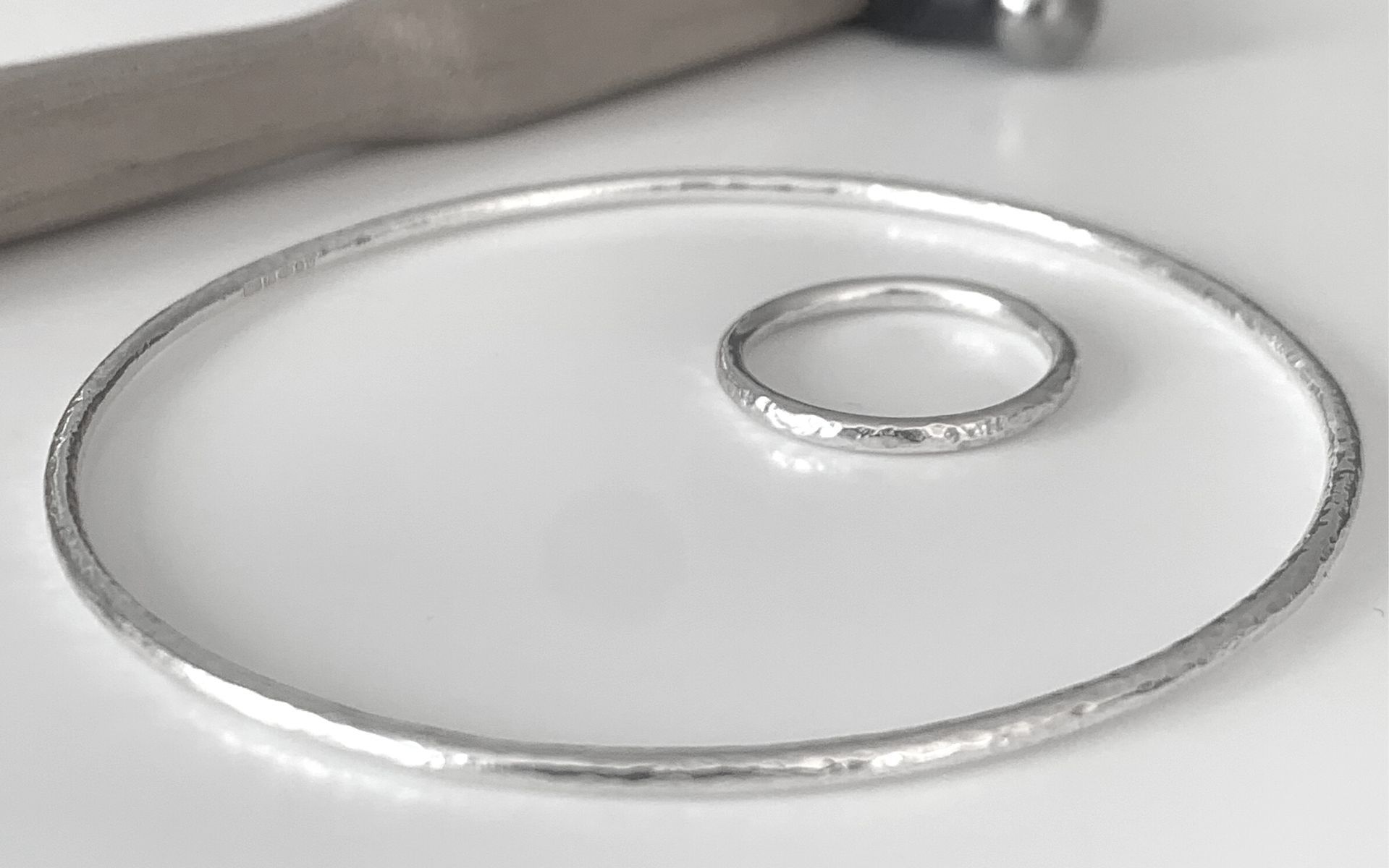 image of a silver ring and bangle