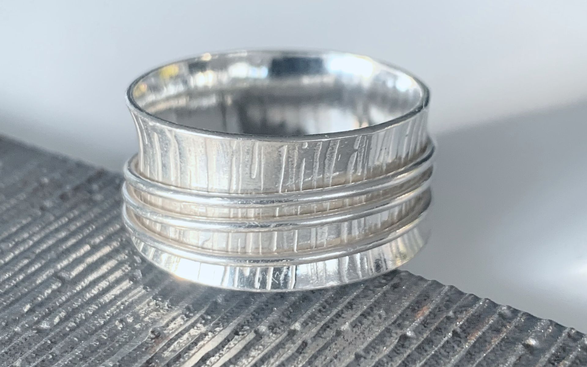 image of a silver spinner or meditation ring