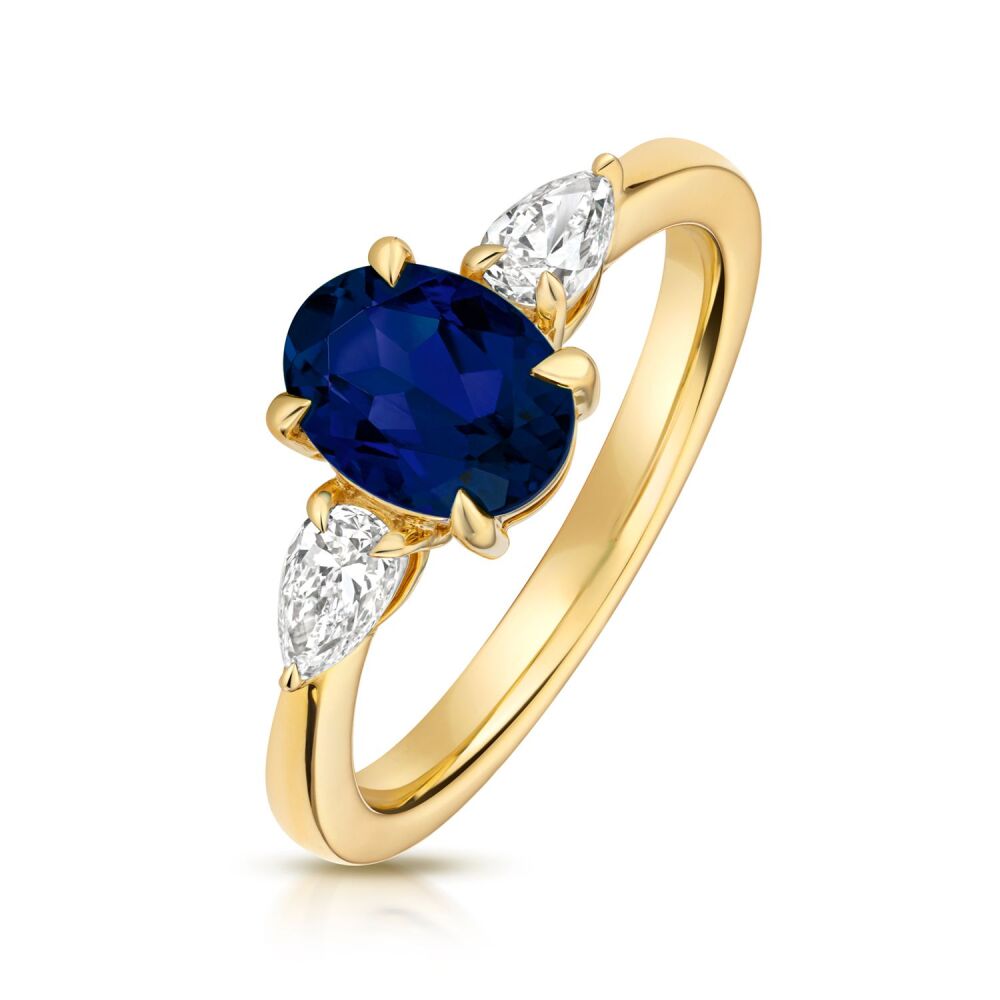 9CT LAB GROWN OVAL SAPPHIRE AND PEAR SHAPE DIAMOND RING