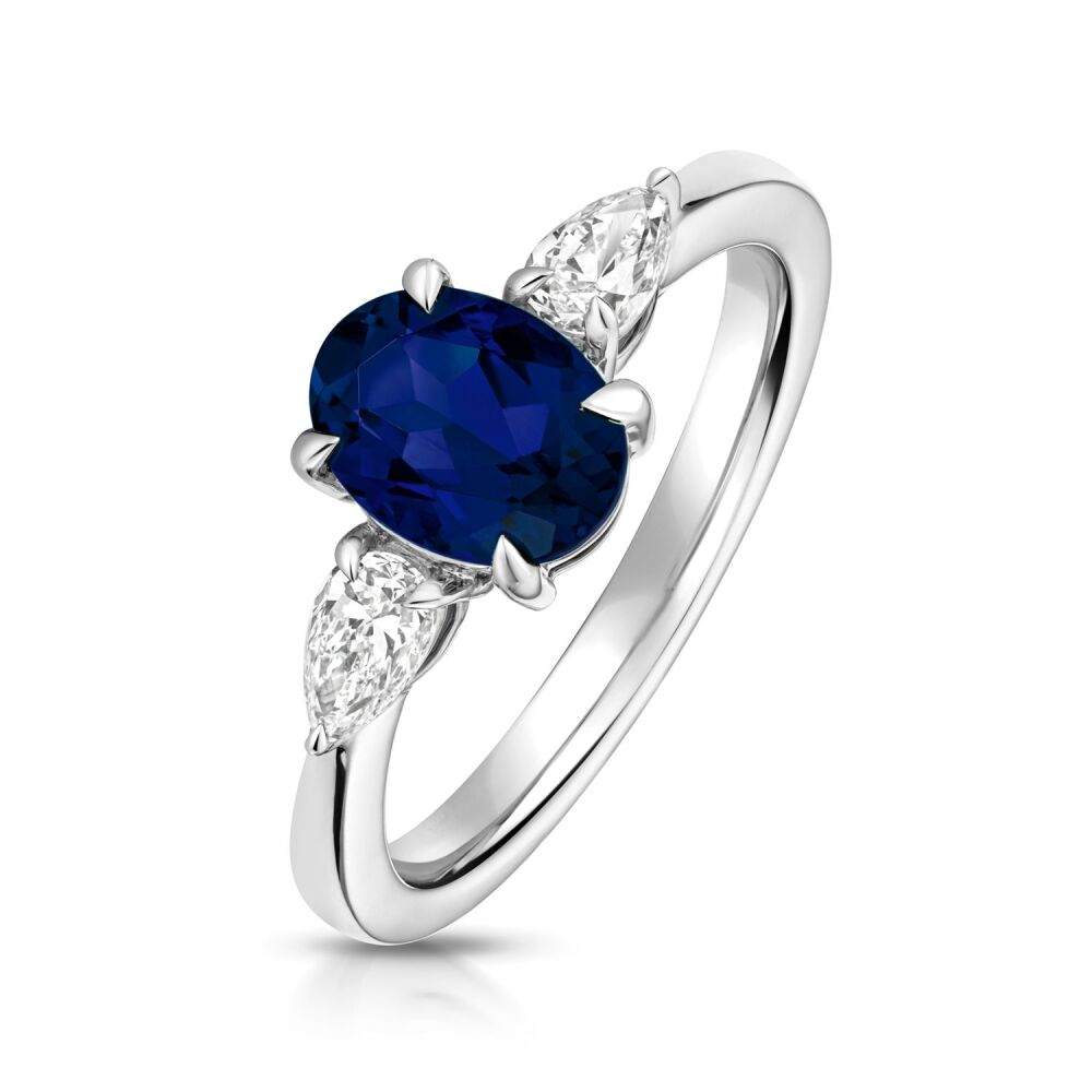 9CT LAB GROWN OVAL SAPPHIRE AND PEAR SHAPE DIAMOND RING