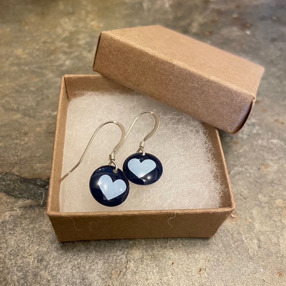 The Tinsmiths round earrings with heart pattern