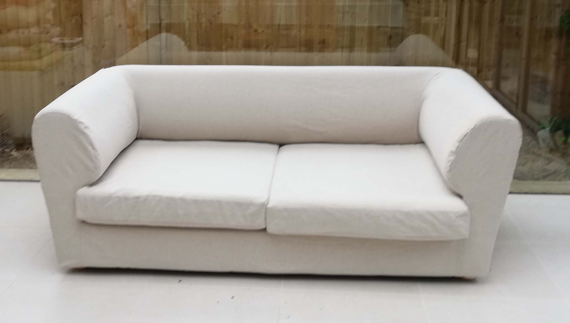 A plain sofa cover with no piping