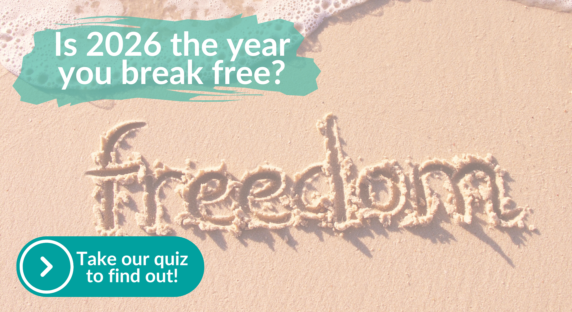 The word freedom written in sand on a beach