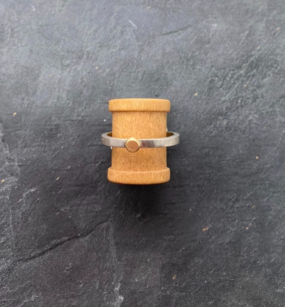 Silver and 18ct yellow gold ring.