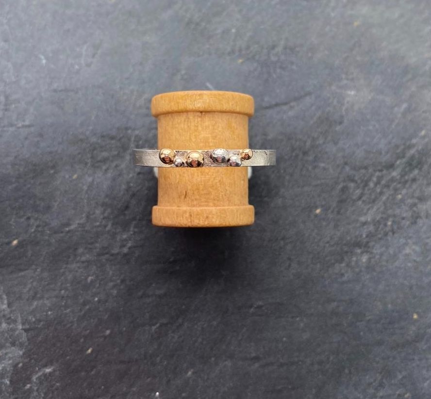 Silver and 18ct yellow gold ring.