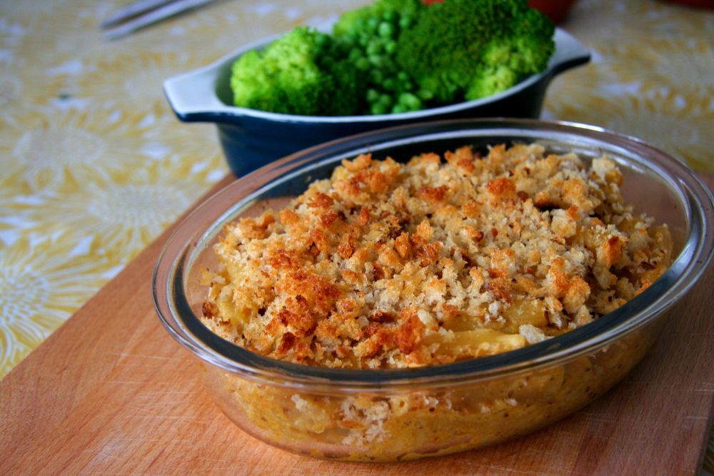 Cashew mac n cheese with vegetables in background