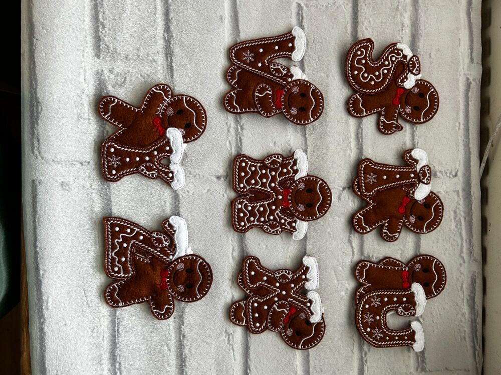 Christmas gingerbread holding an initial hanging gift