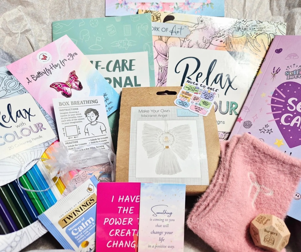 Self care craft box includes colouring books and a craft kit as well as lots of other goodies