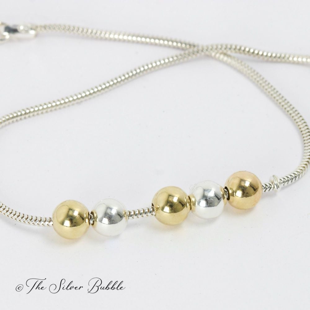 Fidget Bracelet with 9ct Gold and Silver Balls