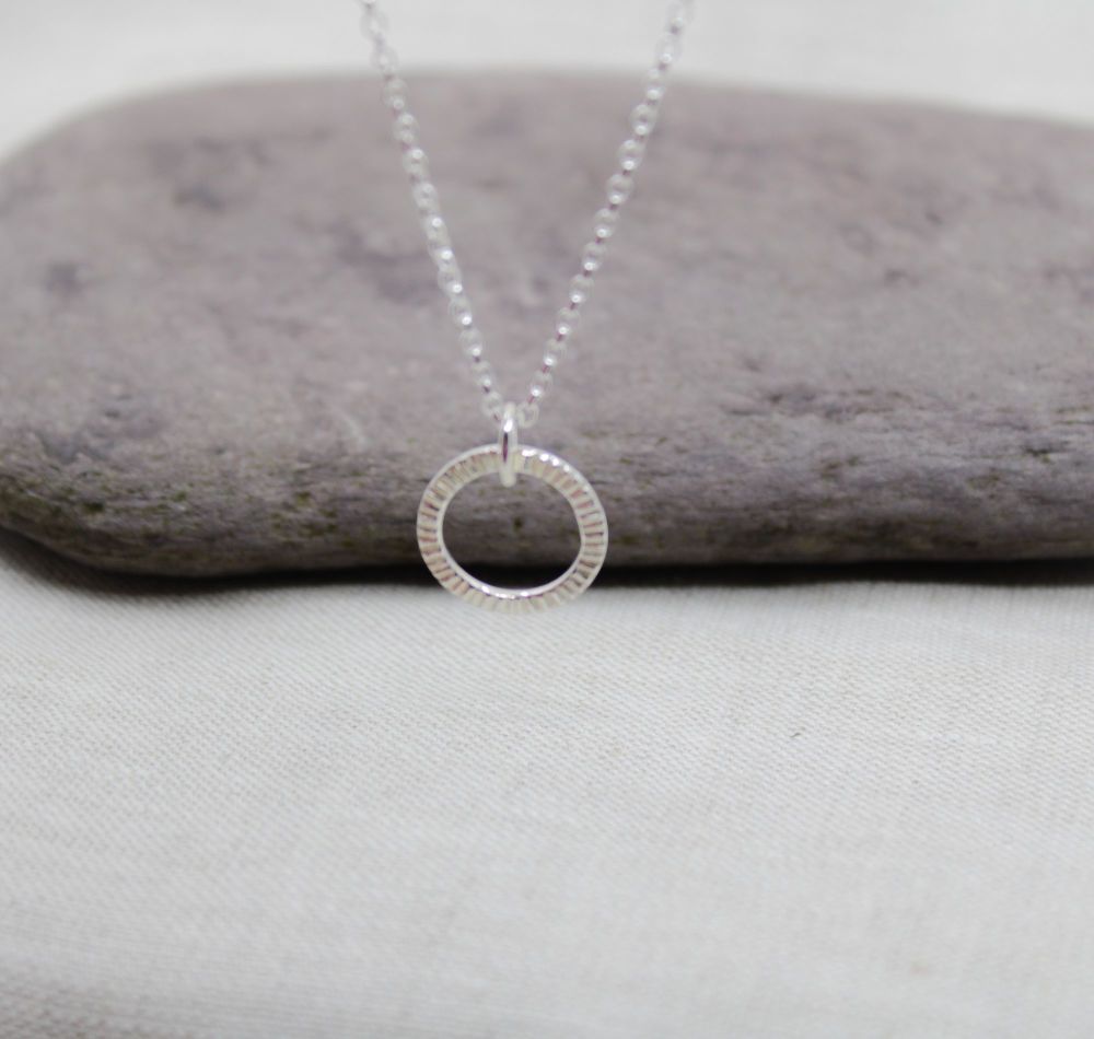 Sterling silver linear textured pendant