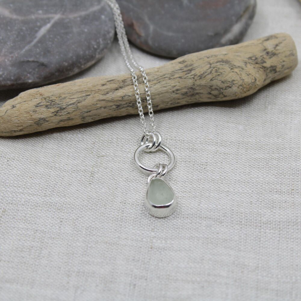 White sea glass and sterling silver pendant