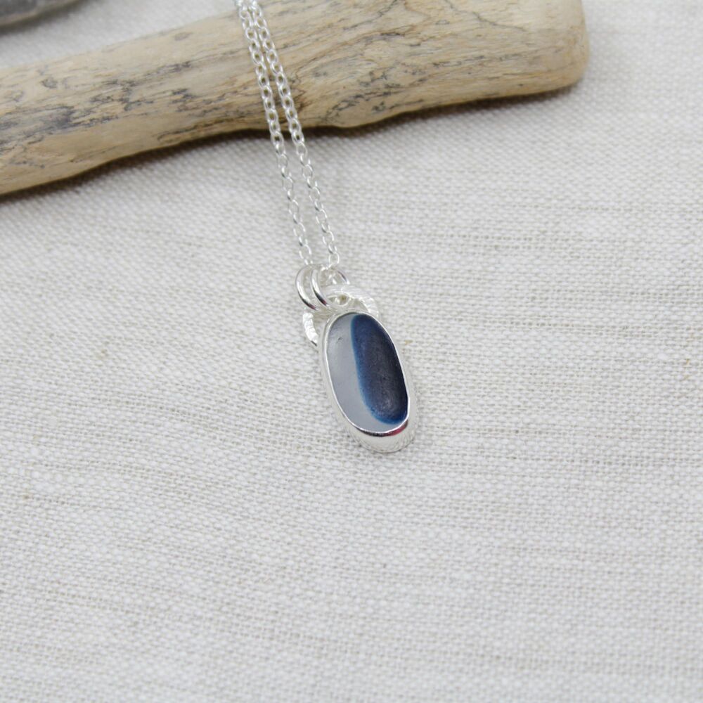 Oval cobalt blue and white multi coloured sea glass pendant
