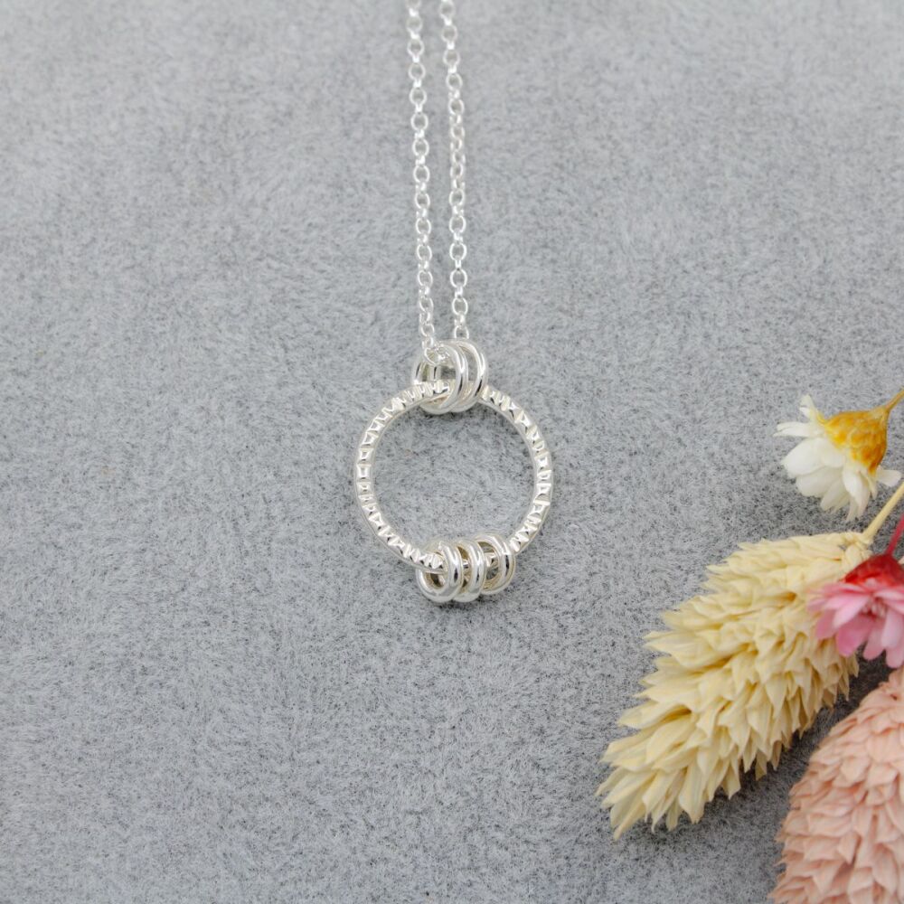 Sterling silver linear textured fidget necklace