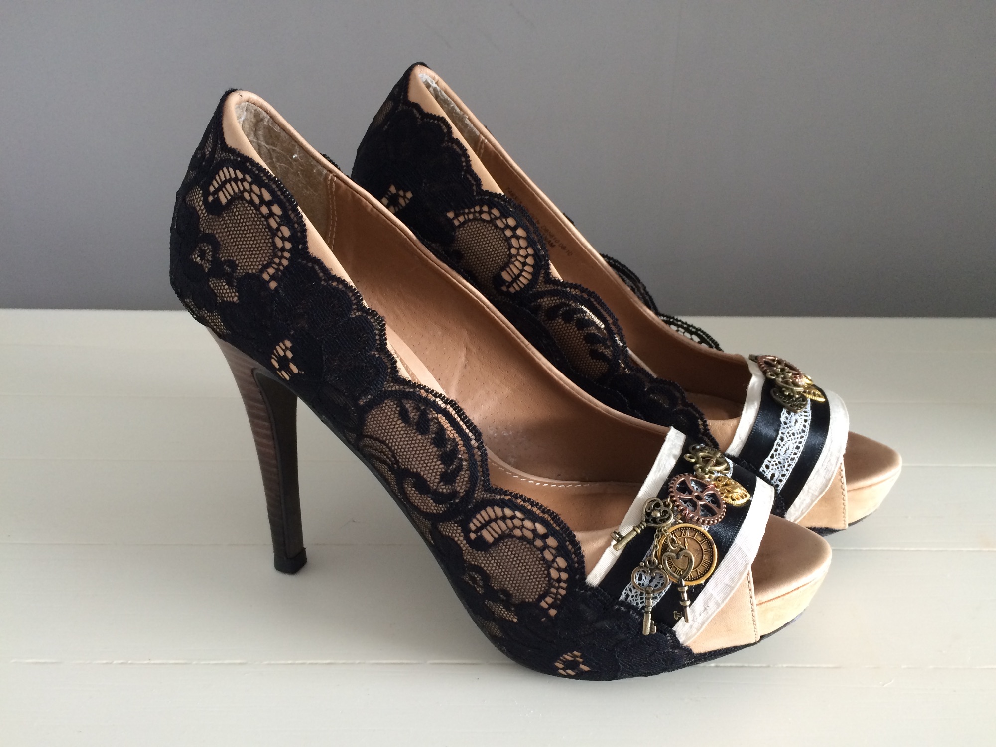 Custom steampunk peep toe shoes by Lace and Love. Black lace with cogs and clock embelishments
