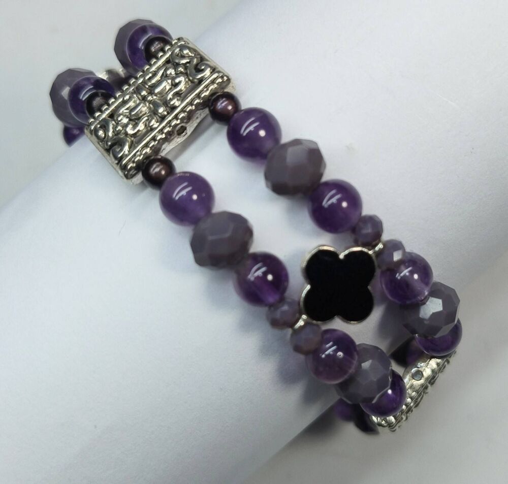 Amethyst Bracelet. Double Strand. Fixed length with decorative clasp.