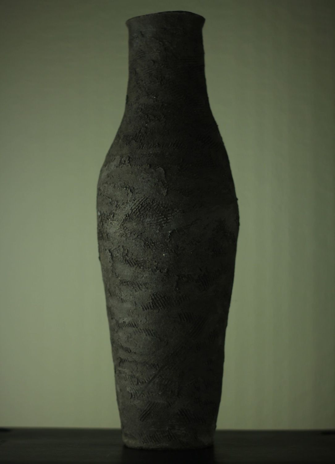 Tall black vessel