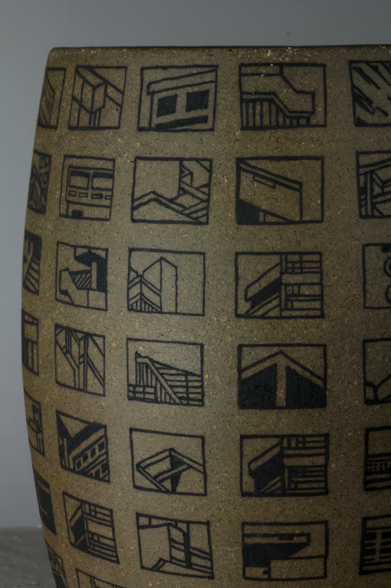 Detail of Brutalist architecture painted onto ceramic vessel