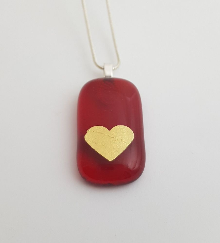 Transparent red pendant with gold mica heart