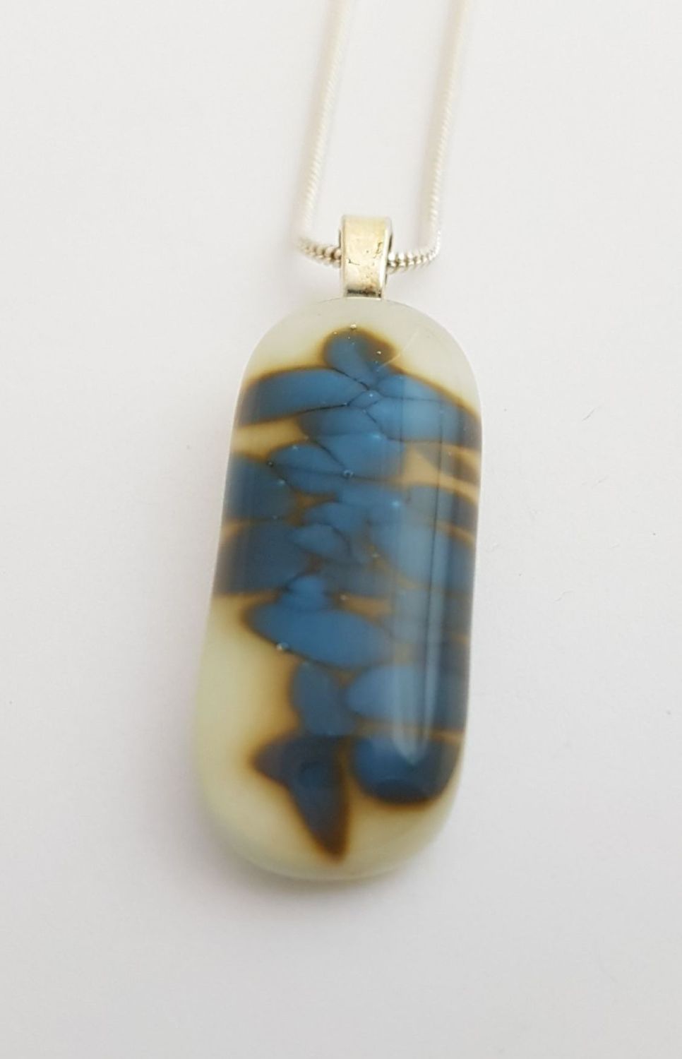 Ivory with Egyptian blue speckles pendant