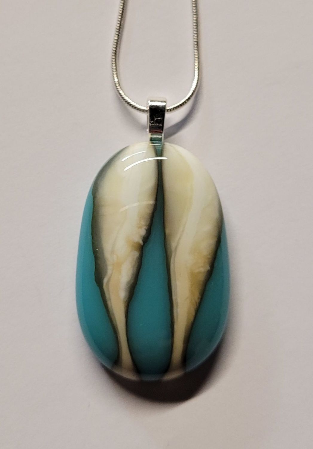 Turquoise and vanilla wavy pebble pendant