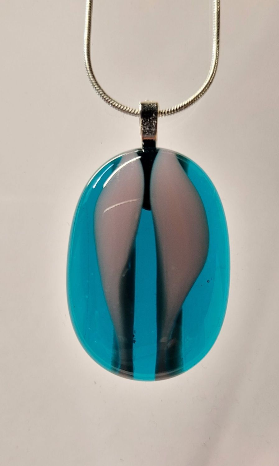 Peacock blue and dusky mauve wavy pebble pendant