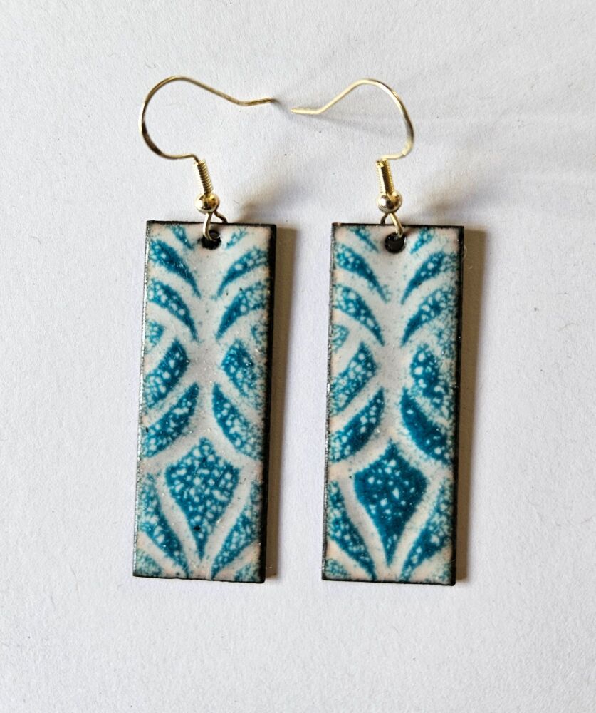 White with teal pattern long earrings