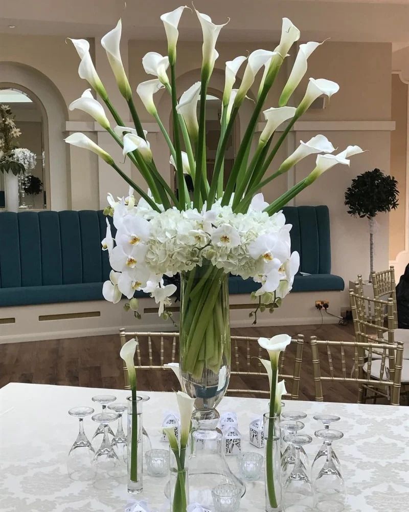 White Calla Lily and Orchid Centerpiece in a Glass Vase