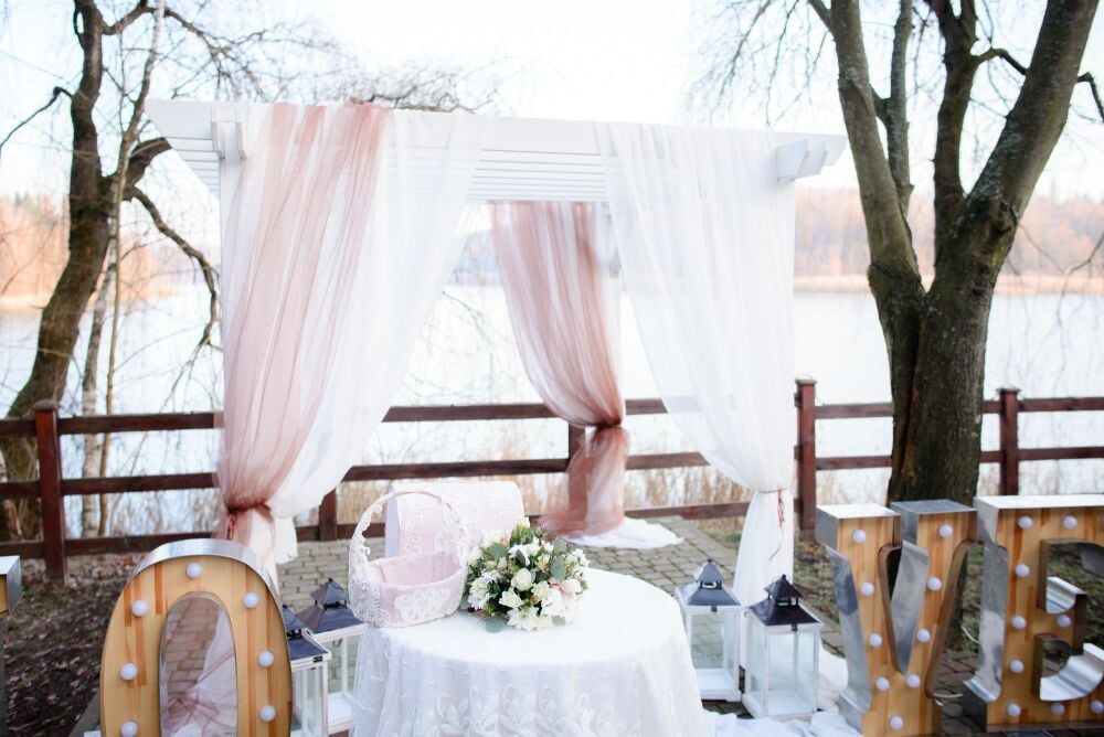 beautiful-wedding-altar-made-white-pink-curtains