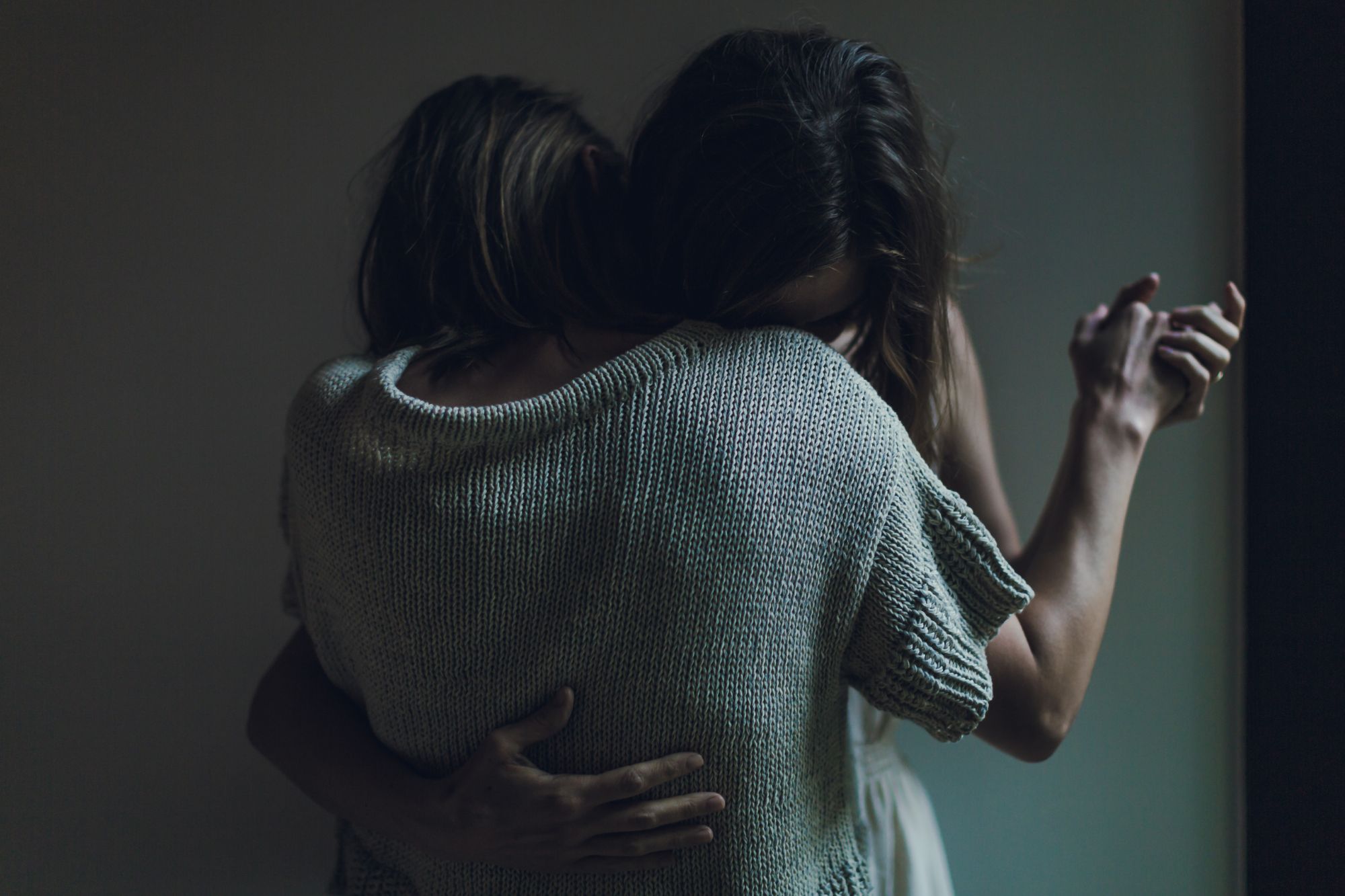 Image of two women embracing.