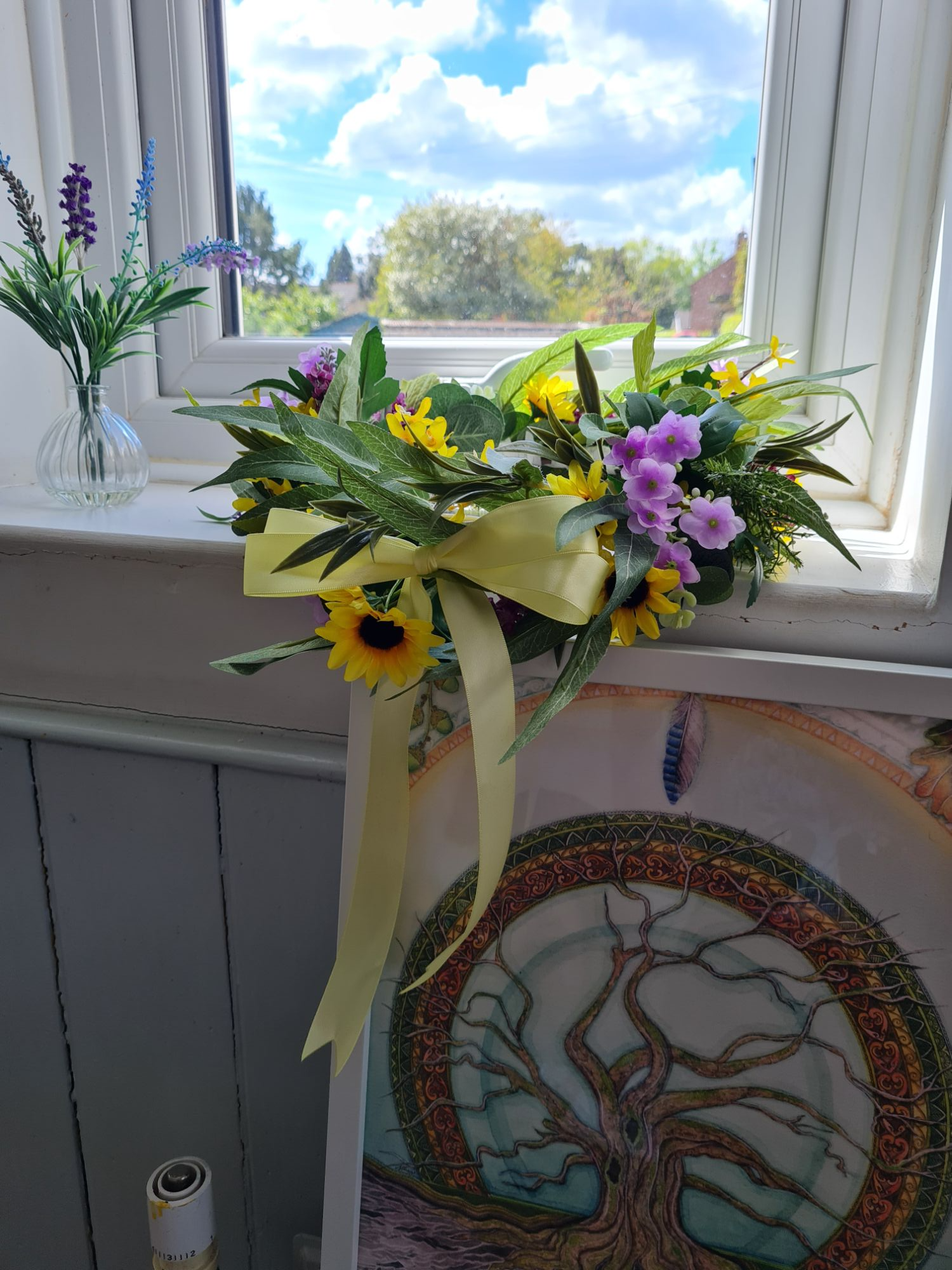 A flower crown on a window ledge that was made during a Birth Blessing.
