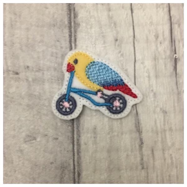 Bird on bike feltie