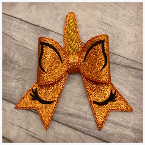 Unicorn bow parts orange glitter