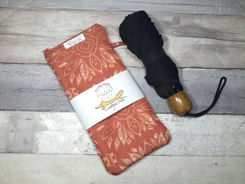Waterproof bag for your wet umbrella. Terracotta colour bag with floral design