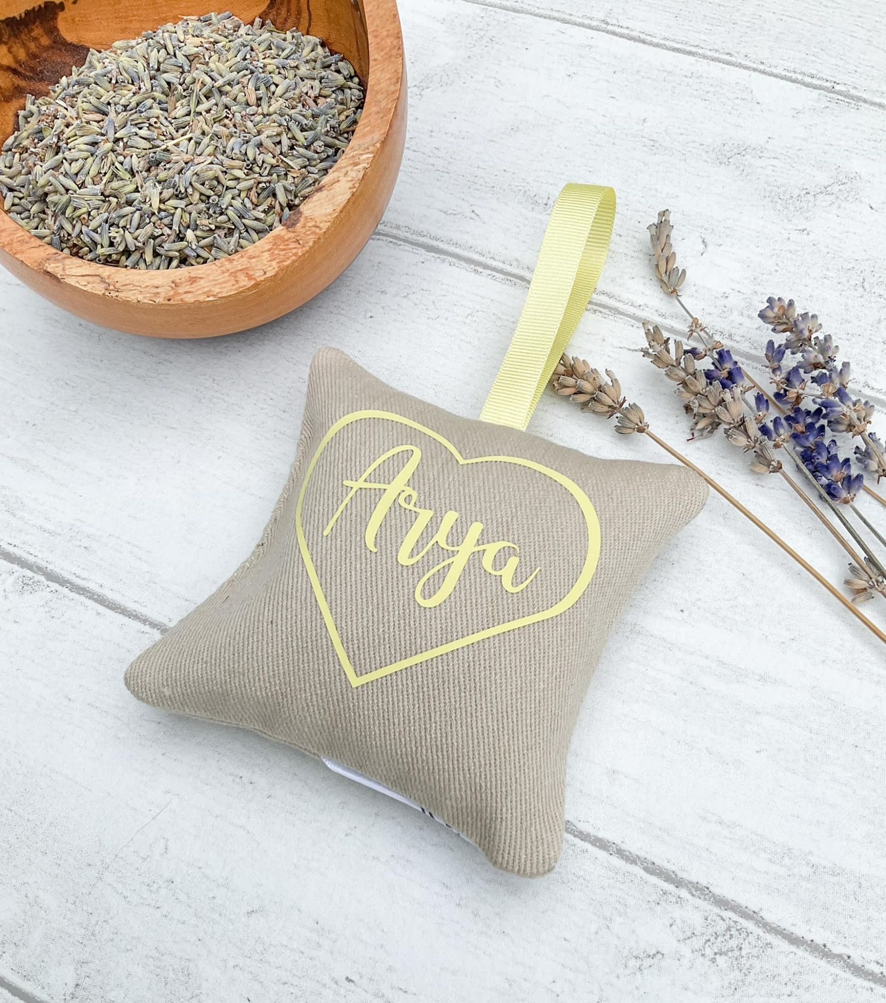 Lavender bag sachet with 'Arya' written on in yellow