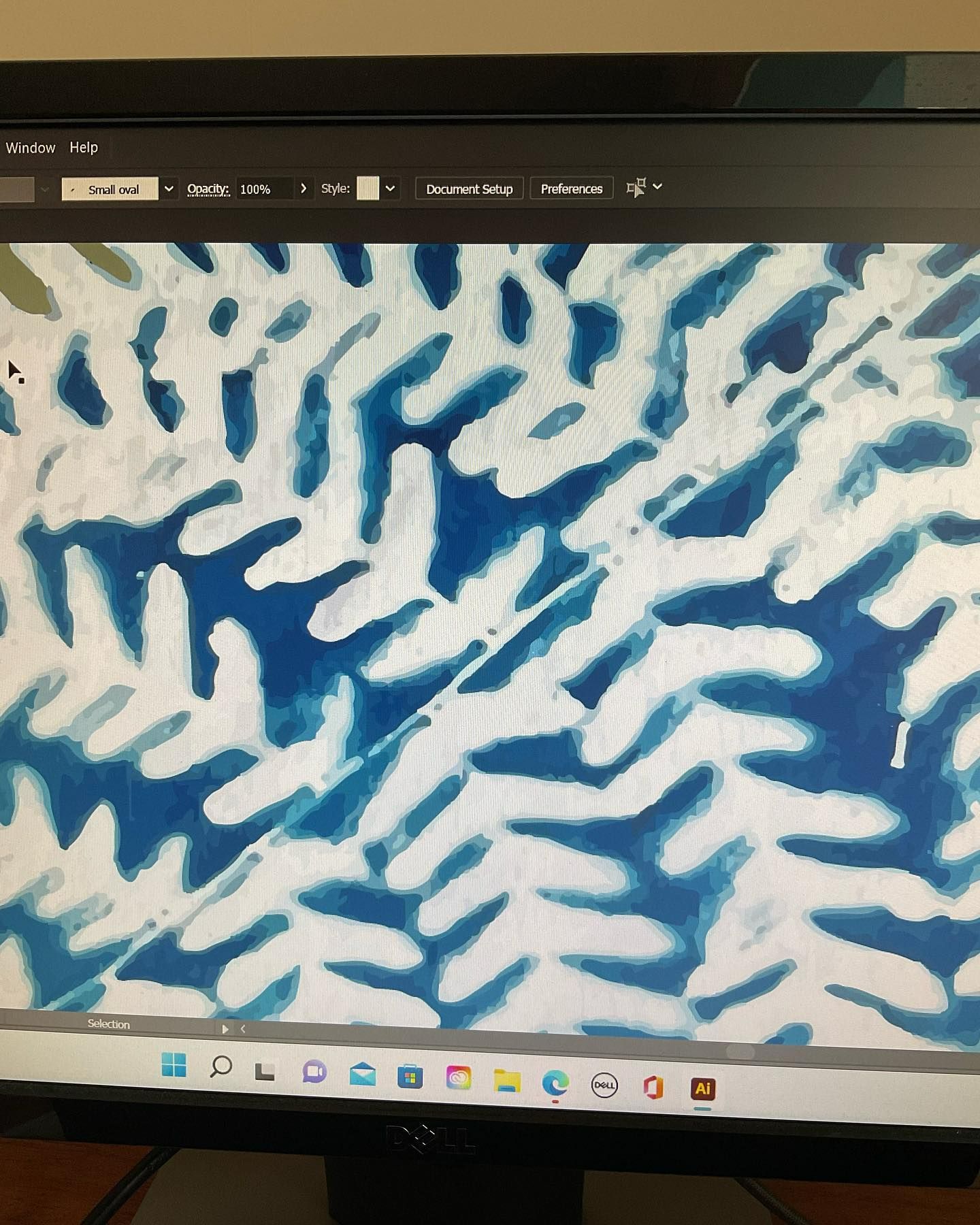 Fern print on a laptop monitor. The sections of the fern leaf are white.