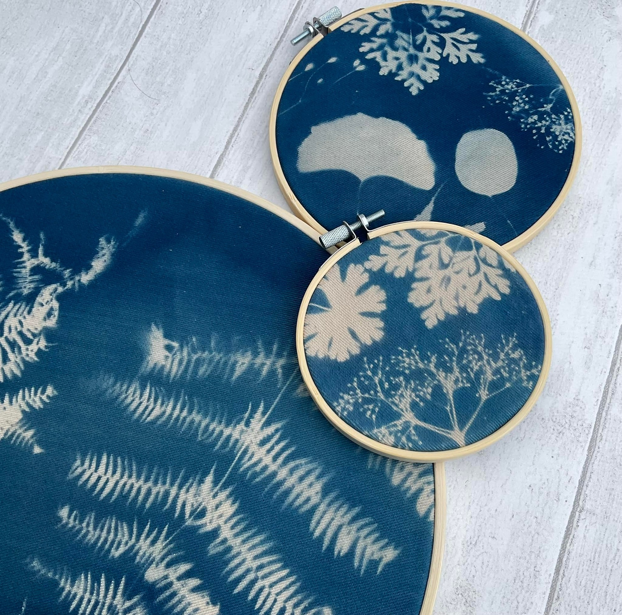 Blue lampshade with silhouettes of plants
