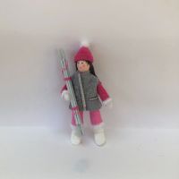 Woman Skier in Fuchsia Pink