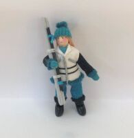 Woman Skier in Turquoise and White