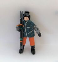 Male Skier green jacket