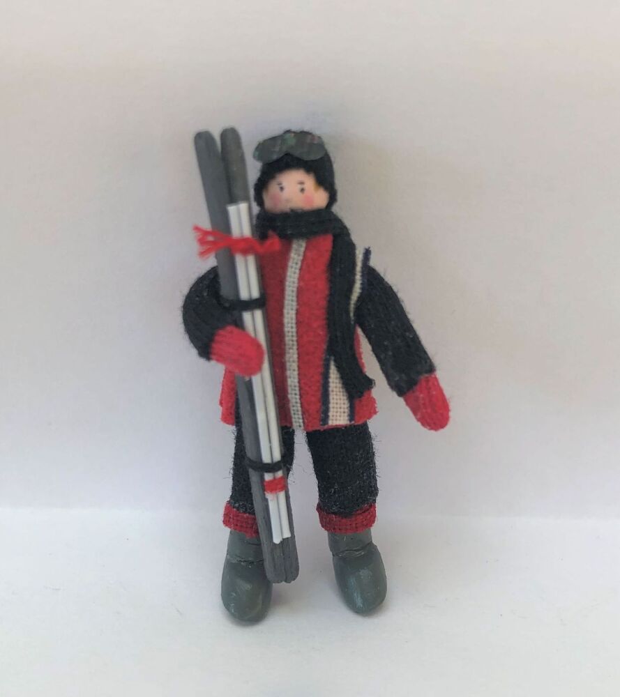 Male Skier  red jacket/black hat