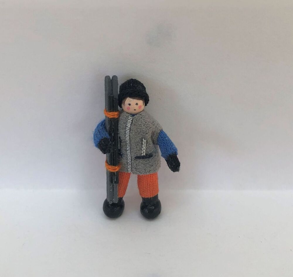 Boy Skier in grey jacket