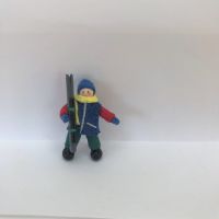 Boy Skier in royal blue jacket