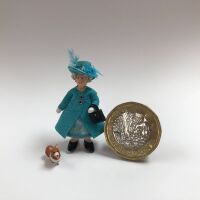 The Queen in Turquoise Blue with Corgi