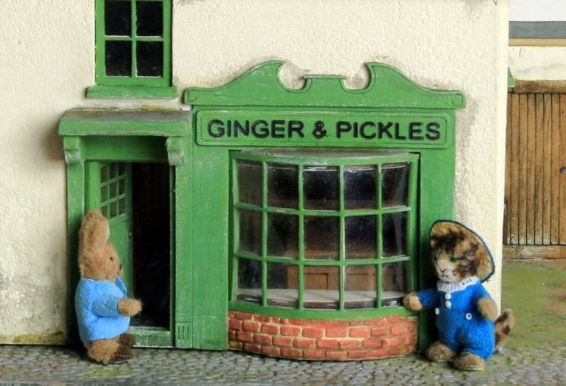 Peter Rabbit and Tom Kitten outside the Ginger and Pickles Shop