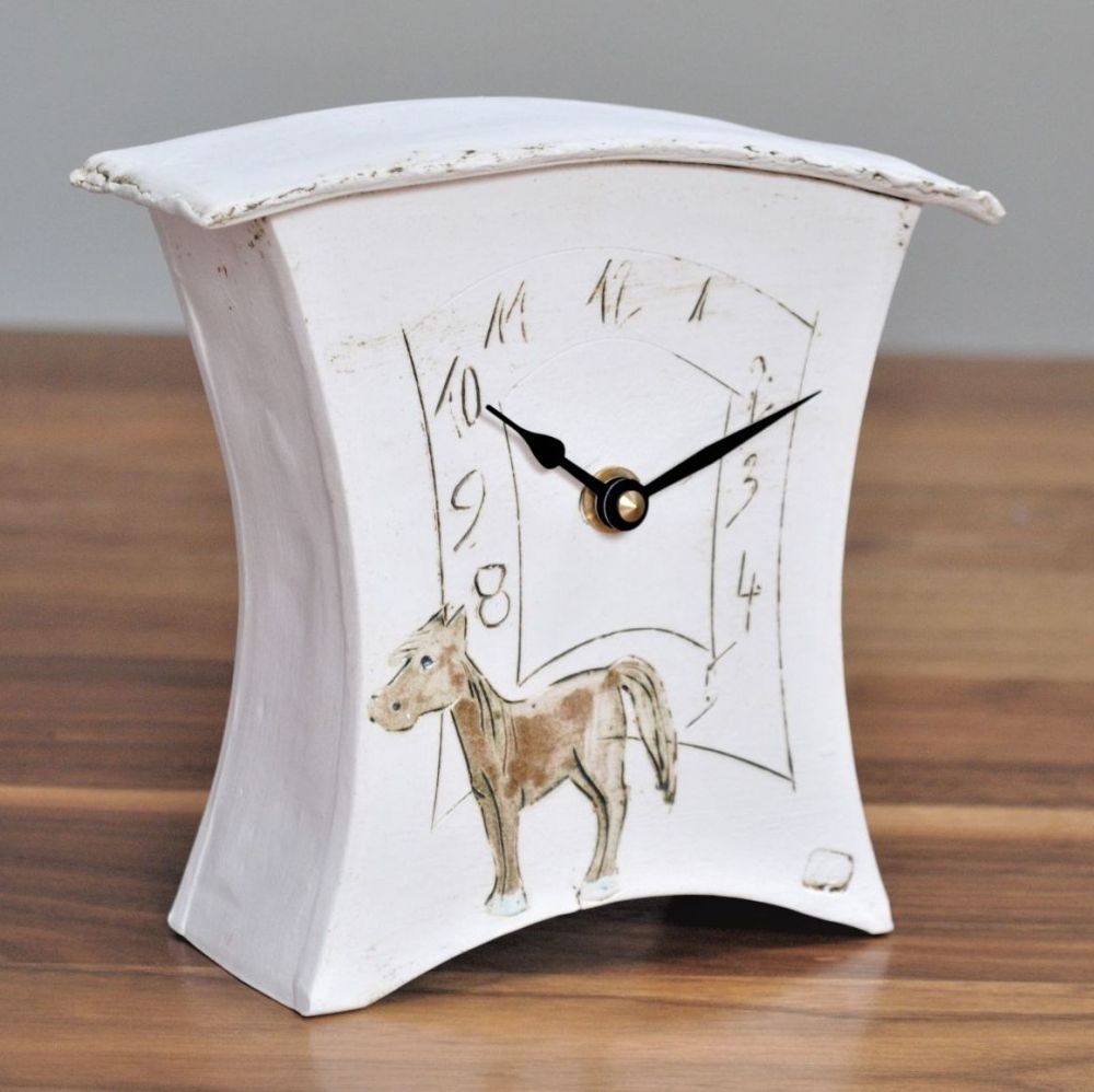 Handmade ceramic mantel clock with a brown horse.